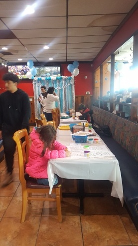 A family celebrates with a party in the dining room